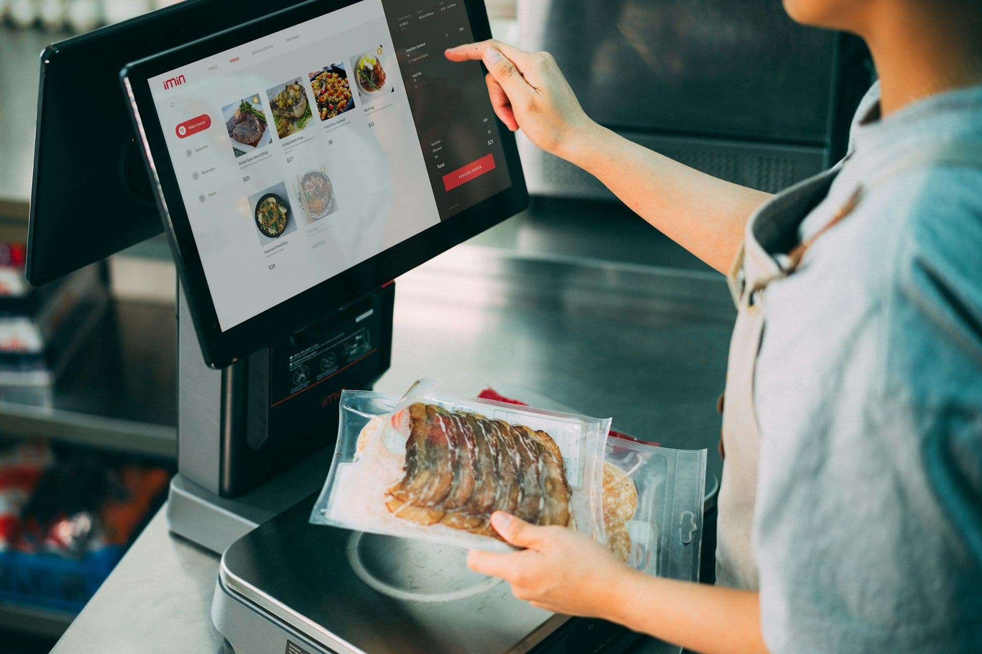 Clover POS terminal at restaurant counter with QuickBooks integration